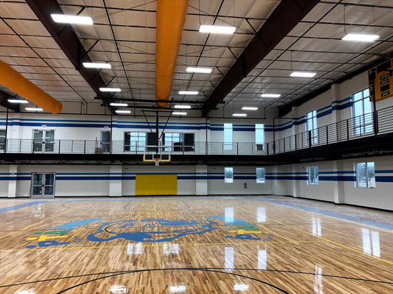 Basketball court in Garland TX lit with 300W LED linear high bay lights